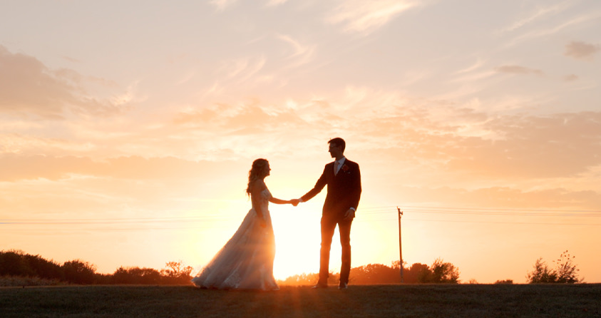 Newlyweds enjoying the sunset at their at-home Minnesota wedding